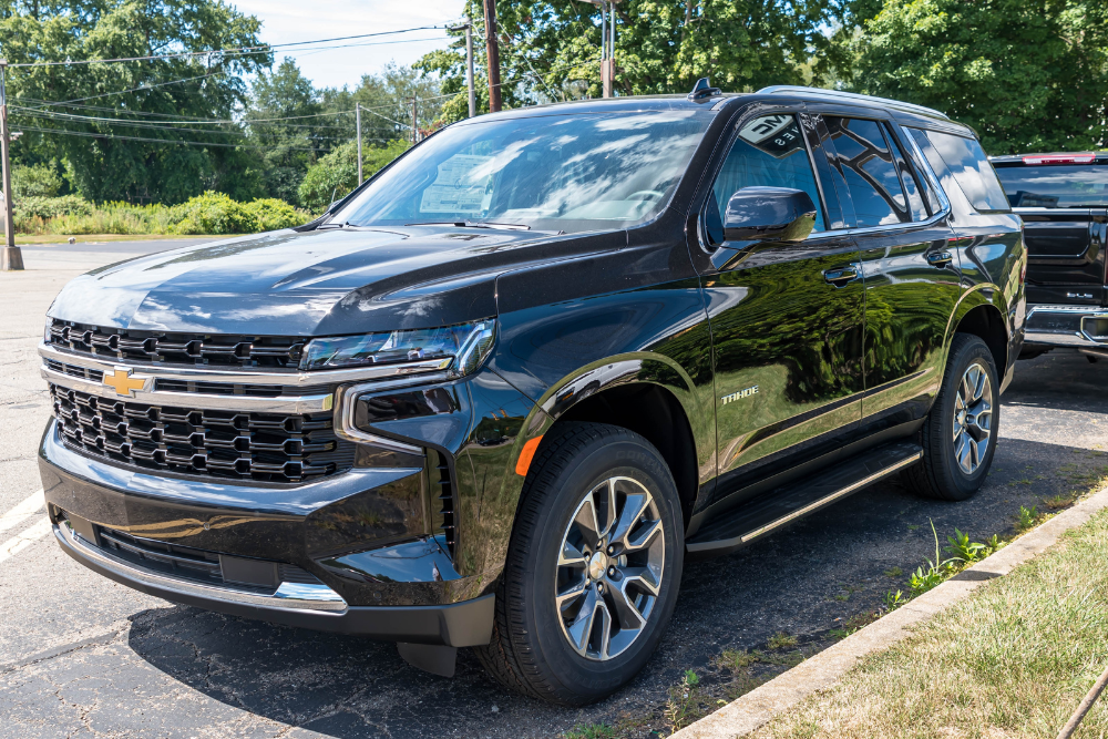 Specialized Chevrolet Suburban & Tahoe Repair in Boca Raton, FL - Boca Auto Fix Chevrolet Suburban & Tahoe Repair, auto repair in Boca Raton, FL at Boca Auto Fix. A black Chevrolet Tahoe parked outside on a sunny summer day.