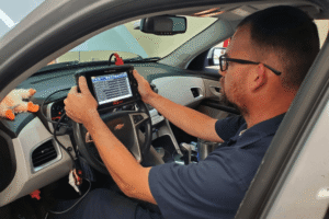 Vehicle diagnostics, auto repair in Boca Raton, FL, at Boca Auto Fix. Image of Doug DeLucca performing advanced vehicle diagnostics with a professional Snap-on scan tool inside a vehicle, accurately identifying check engine light faults, electrical issues, and drivability problems before recommending the right repair.